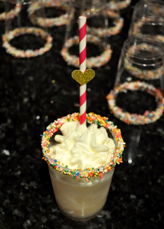 I rimmed some of my glasses with white chocolate and sprinkles and then made homemade butterbeer to pour in topped with whipped cream.